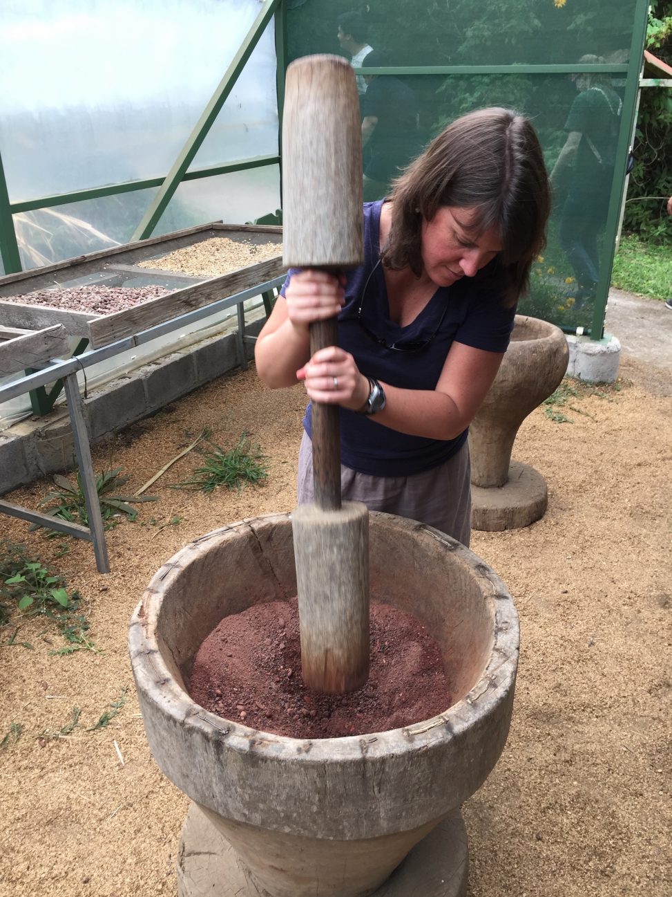 Kelly grinding cacao beans Photos from Chris Hardie